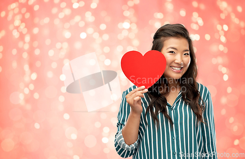 Image of happy asian woman with red heart