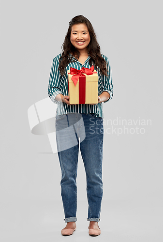 Image of happy asian woman with birthday present