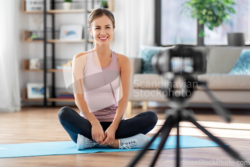 Image of woman or sports blogger streaming online at home