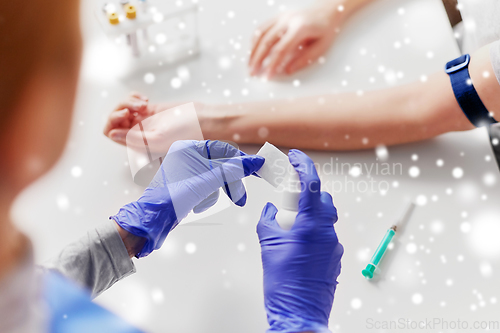 Image of doctor and patient preparing for blood test