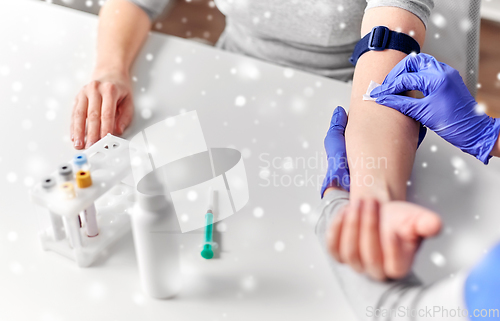 Image of doctor and patient preparing for blood test