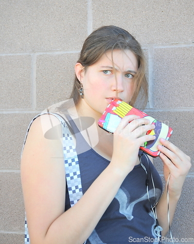 Image of Female listening to music.