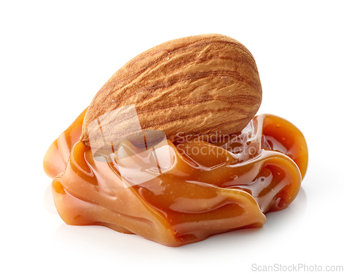 Image of almond in melted caramel