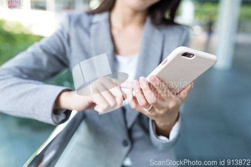 Image of Businesswoman use of mobile phone