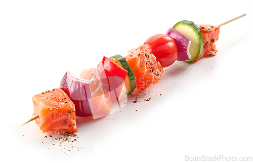 Image of raw salmon and vegetable skewer