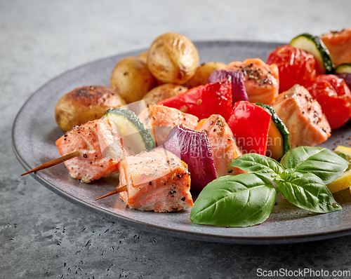 Image of grilled salmon skewers and vegetables