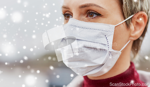 Image of young woman wearing protective medical mask