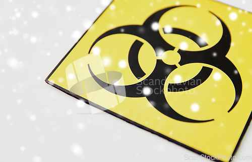 Image of biohazard caution sign on white background