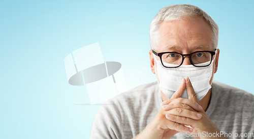 Image of close up of senior man in glasses and medical mask