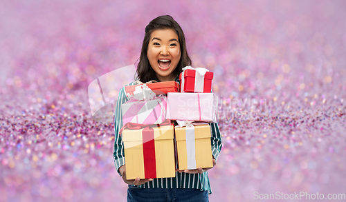 Image of happy asian woman with birthday present