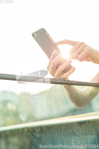 Image of Woman using cellphone