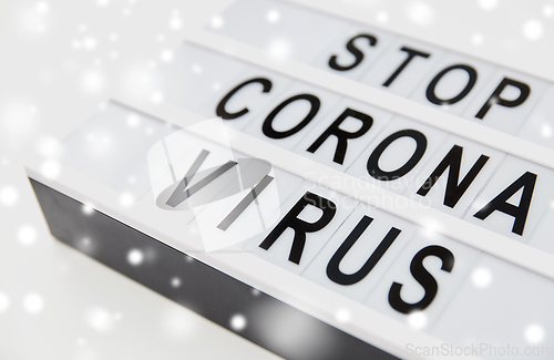 Image of close up of lightbox with stop corona virus words