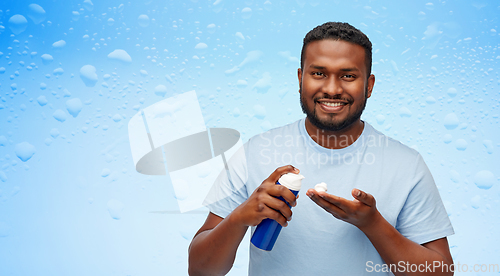 Image of happy african american man with shaving cream