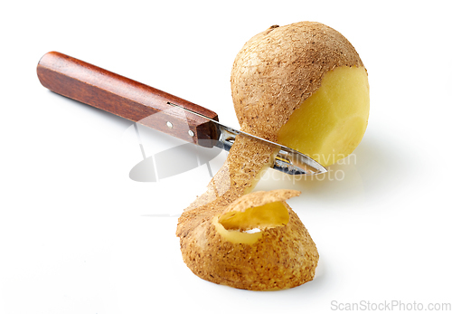 Image of peeling potato