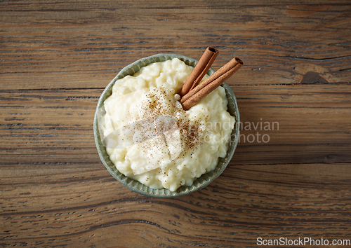 Image of bowl of rice milk pudding with cinnamon