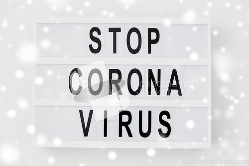 Image of lightbox with stop coronavirus caution words