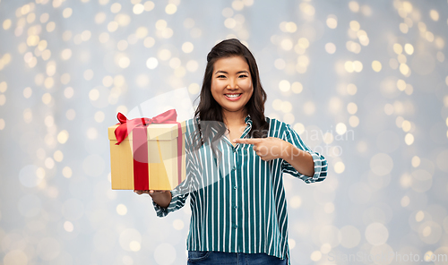 Image of happy asian woman with birthday present