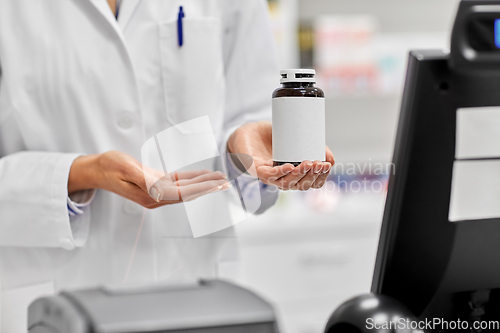 Image of close up of pharmacist with medicine at pharmacy