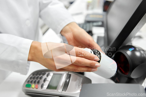 Image of close up of pharmacist with medicine at pharmacy