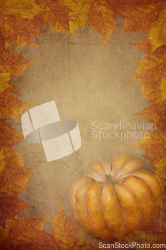 Image of pumpkin and maple leaves