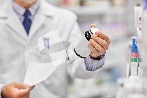 Image of close up of pharmacist with medicine at pharmacy