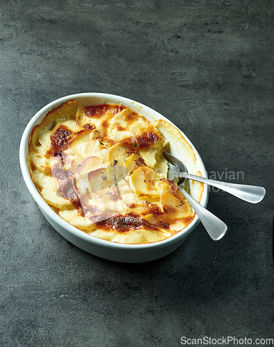 Image of bowl of freshly baked potato gratin