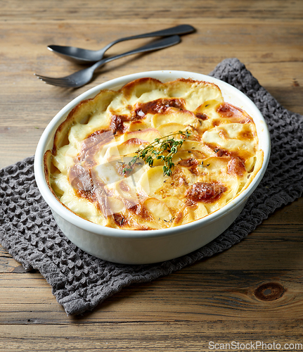 Image of bowl of freshly baked potato gratin