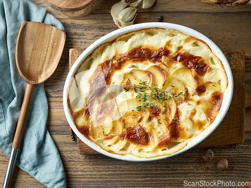 Image of bowl of freshly baked potato gratin
