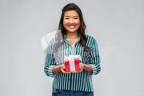 Image of happy asian woman with birthday or christmas gift