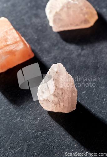 Image of quartz crystals and gem stones on slate background