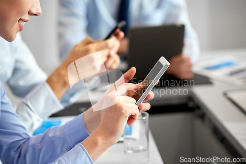 Image of close up of businesswoman with smartphone