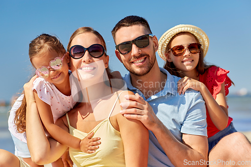 Image of happy family on summer beach