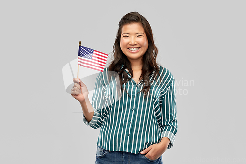 Image of happy asian woman with flag of america