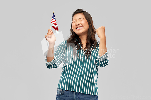 Image of happy asian woman with flag of america