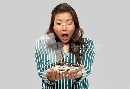 Image of smiling asian woman in glasses or student