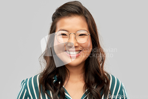 Image of portrait of happy asian woman in glasses