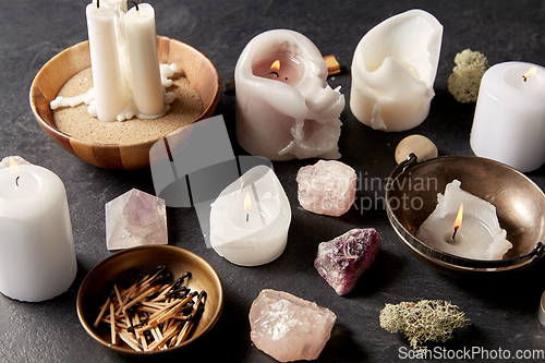 Image of burning candles and crystals for magic ritual