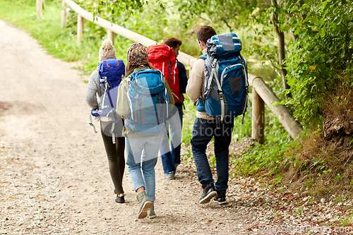 Image of group of friends with backpacks hiking