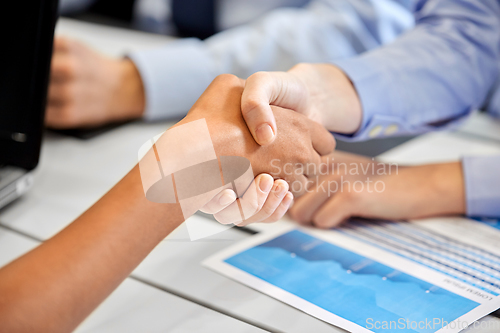 Image of close up of handshake at office