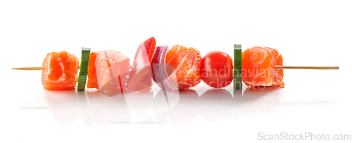 Image of fresh raw salmon and vegetable skewer