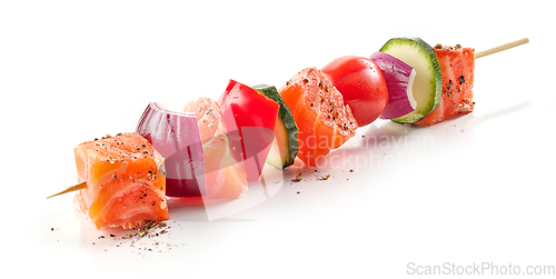 Image of fresh raw salmon and vegetable skewer