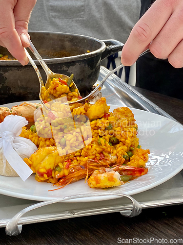 Image of Traditional Paella serving at restaurant in Marbella, Spain