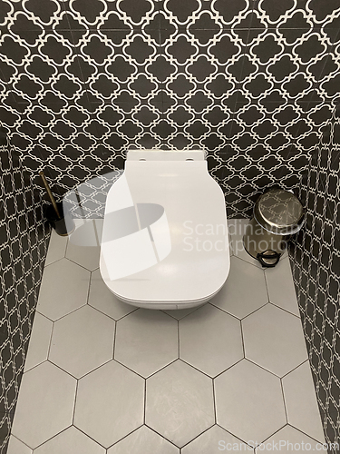 Image of toilet bowl in restroom