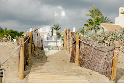 Image of backyard gate to Marbella beach