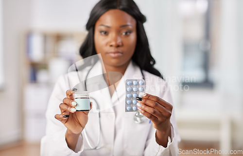 Image of african american doctor with medicine at hospital