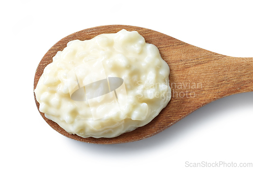 Image of wooden spoon of rice pudding