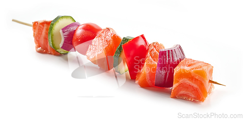 Image of fresh raw salmon and vegetable skewer