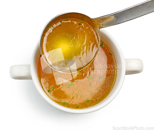 Image of chicken broth pouring into bowl