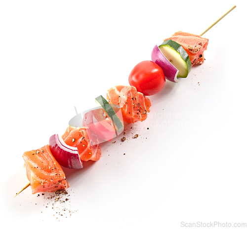 Image of raw salmon and vegetable skewer