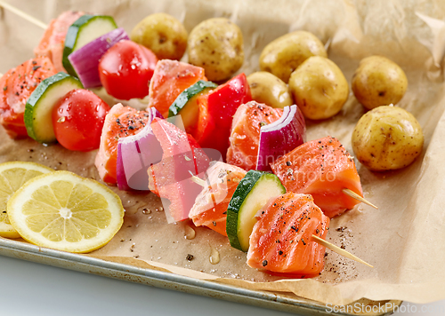 Image of raw salmon and vegetable skewers